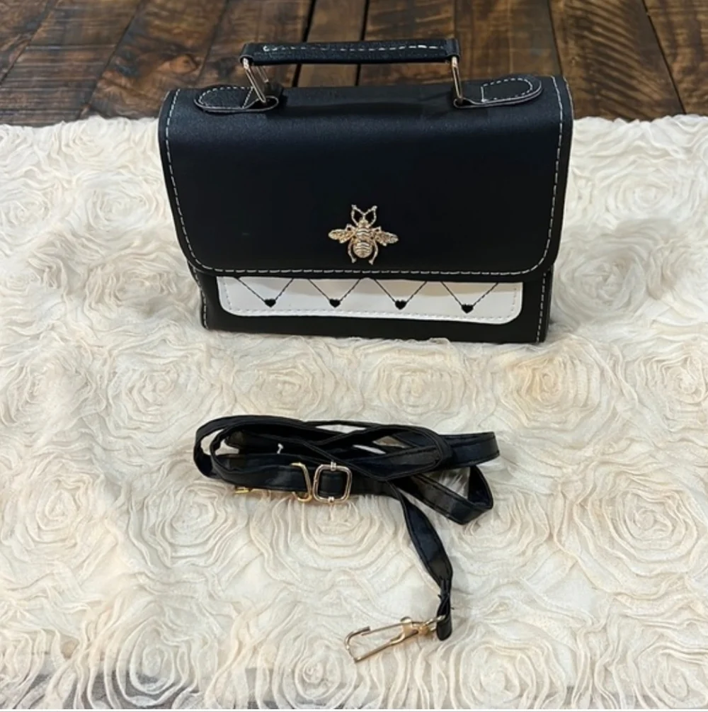 Elegant Black and White Crossbody Bag with Bee Detail